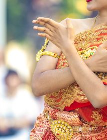 Asian Thai Female dresses the vintage traditional dress and dances with the Thai dance style at the outdoor in the event., Thailand